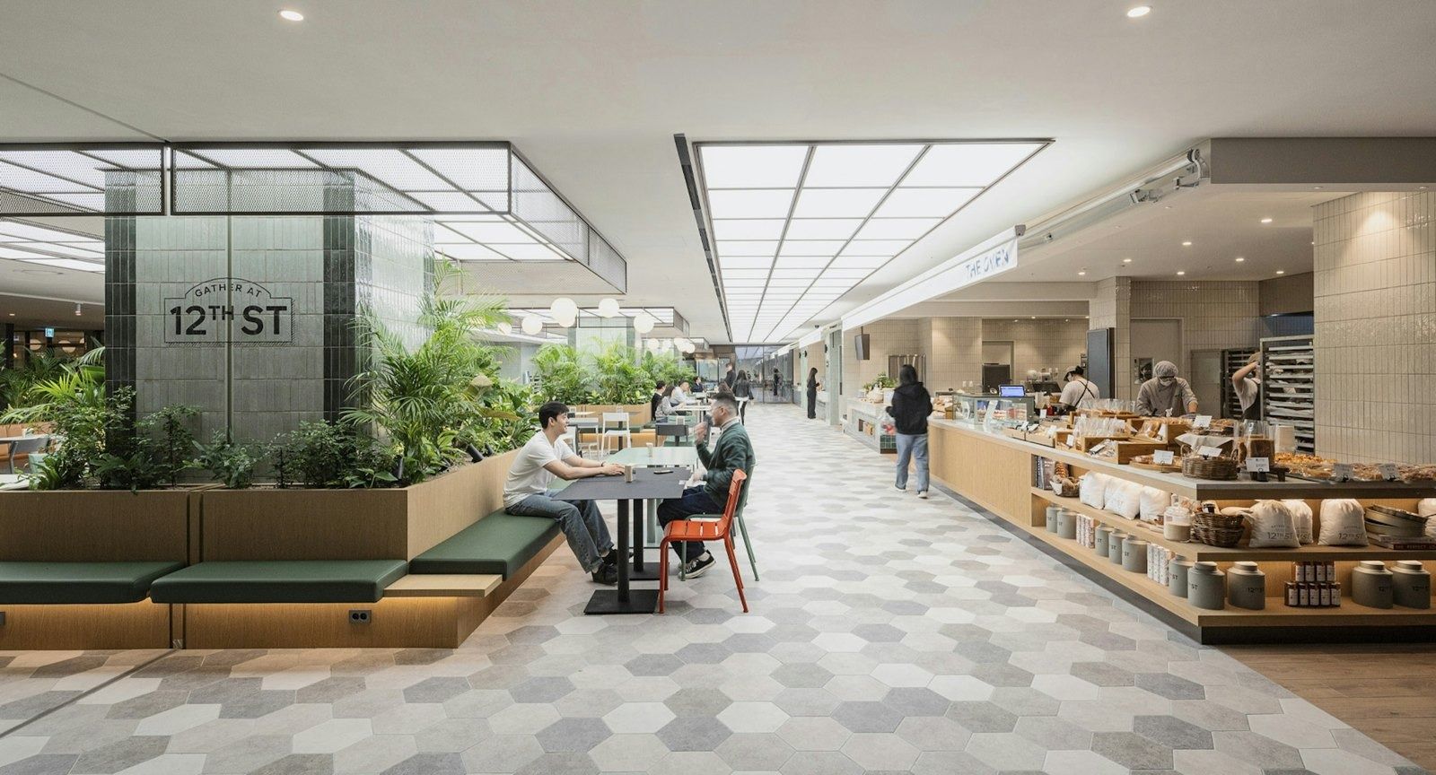 Hyundai Motor Company: Indoor street with planters and a café