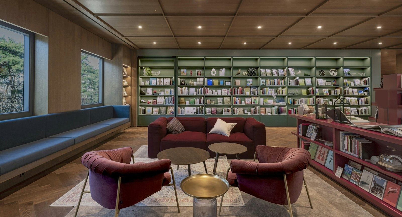 Hyundai Motor Company: Library lounge with red armchairs and bookshelves