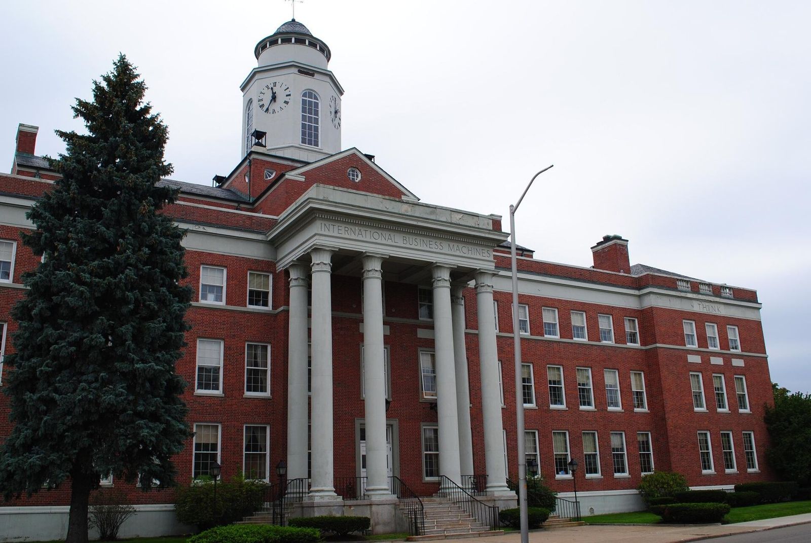 A red-brick IBM building with white columns in Endicott