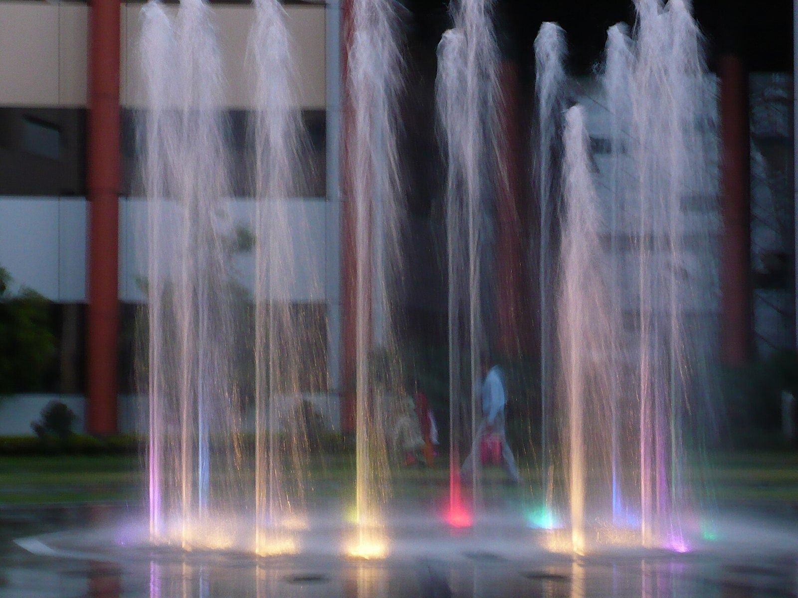 Infosys: Lit fountain jets in front of a building