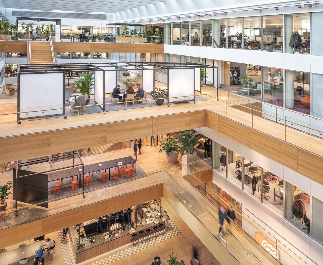 ING Group: Atrium platforms with steel-framed meeting pavilions above a café level
