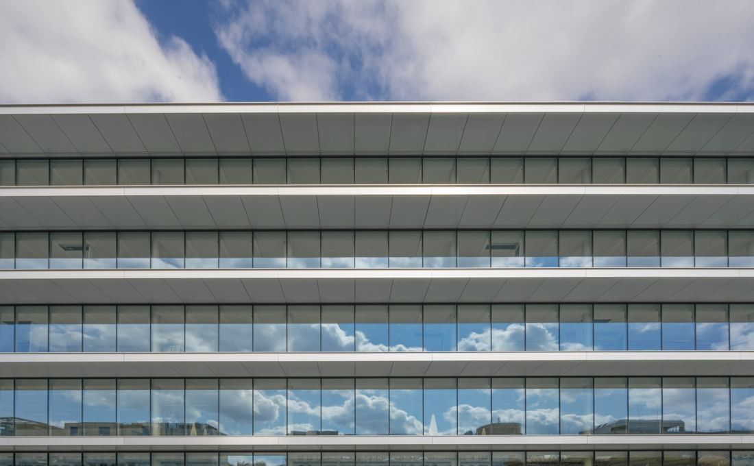 ING Group: Close-up of horizontal glass bands reflecting clouds