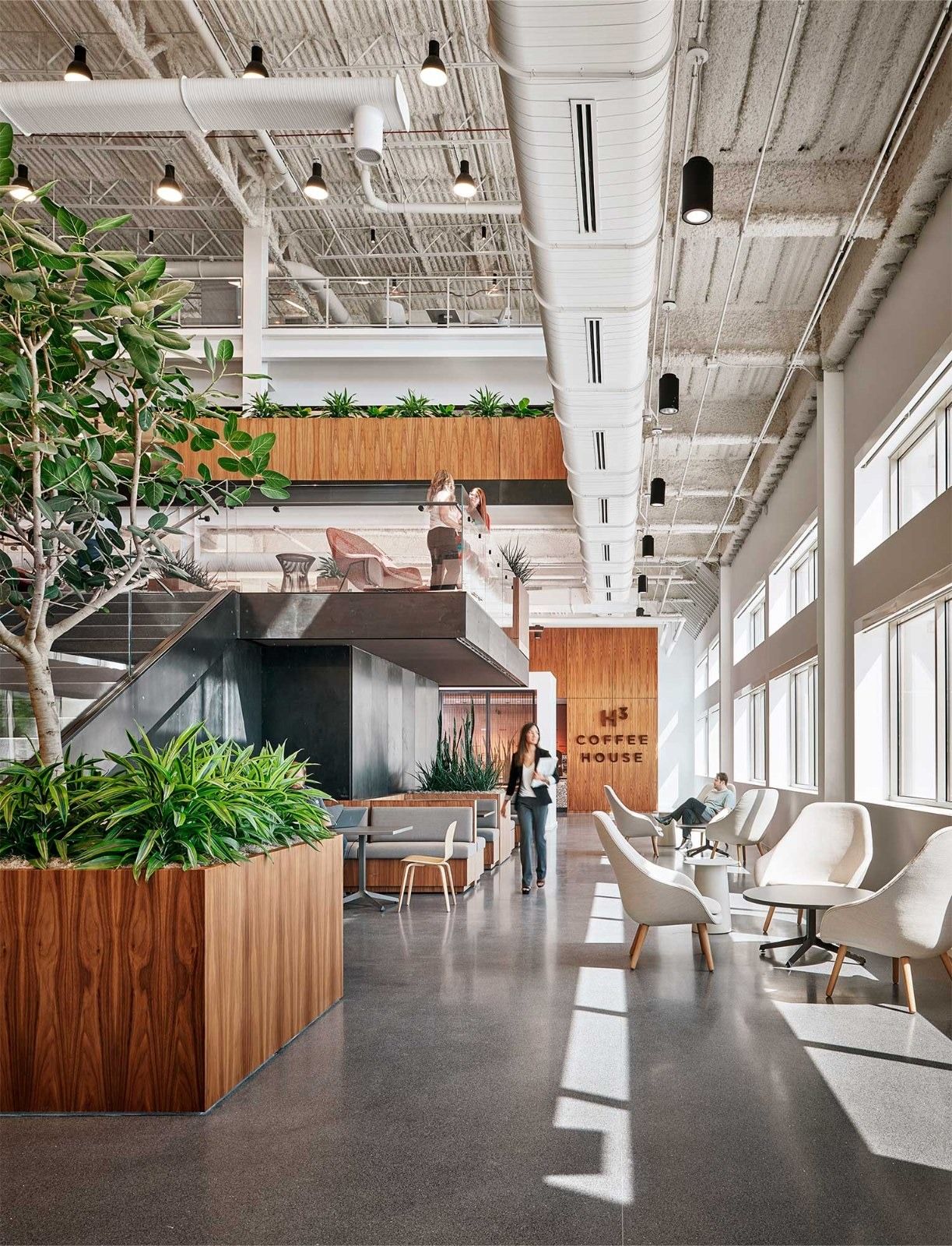 Insight Enterprises: A corridor with planters and lounge chairs
