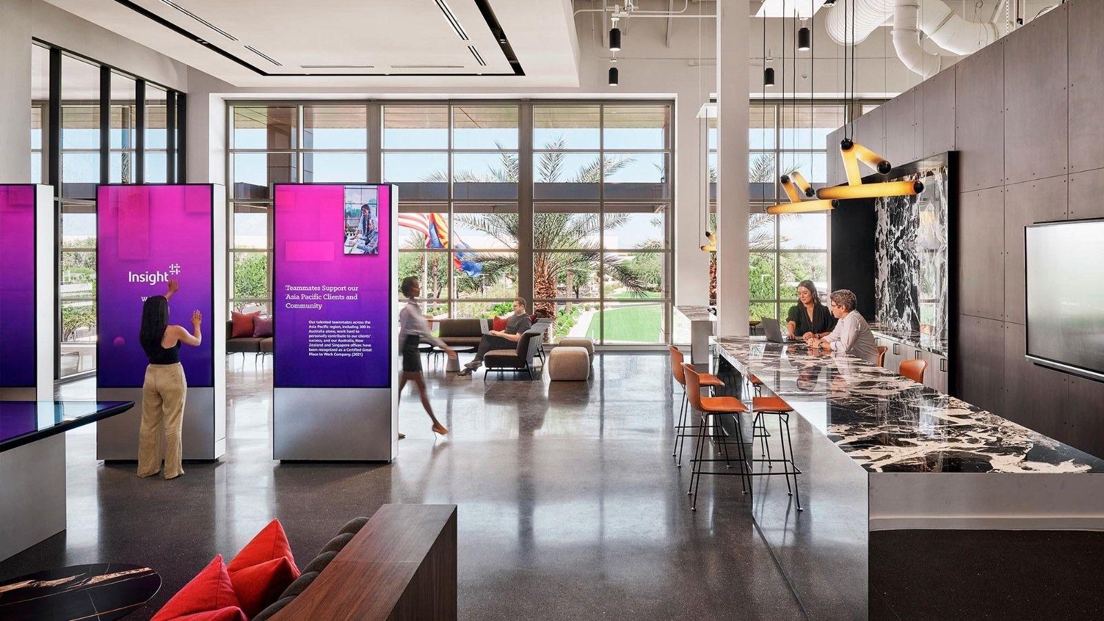 Insight Enterprises: Digital panels and a bar counter in an open hall