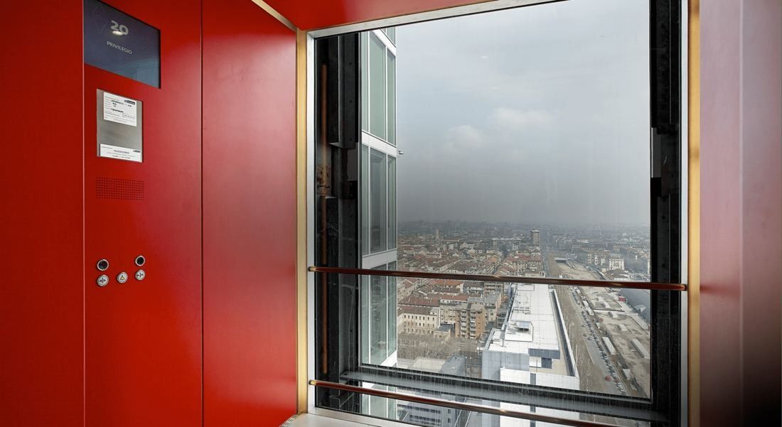 Intesa Sanpaolo: A red wall beside an open window looking down over Turin