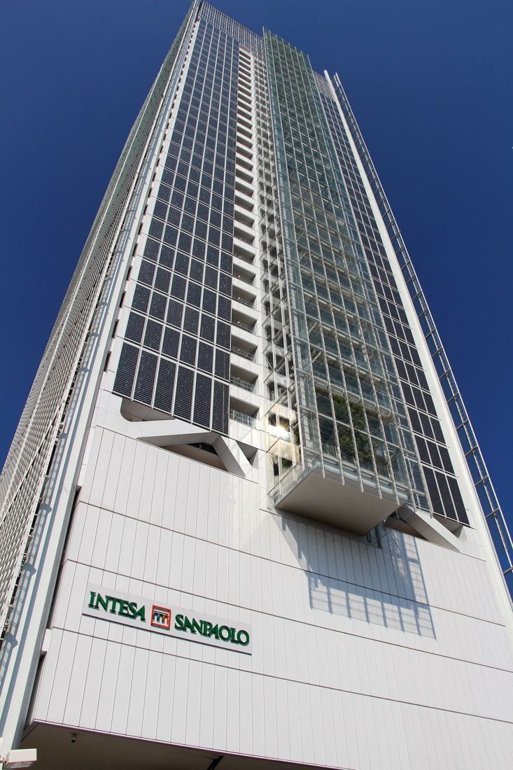 Intesa Sanpaolo: Close view looking up the tower from its base, with the company name on a white wall