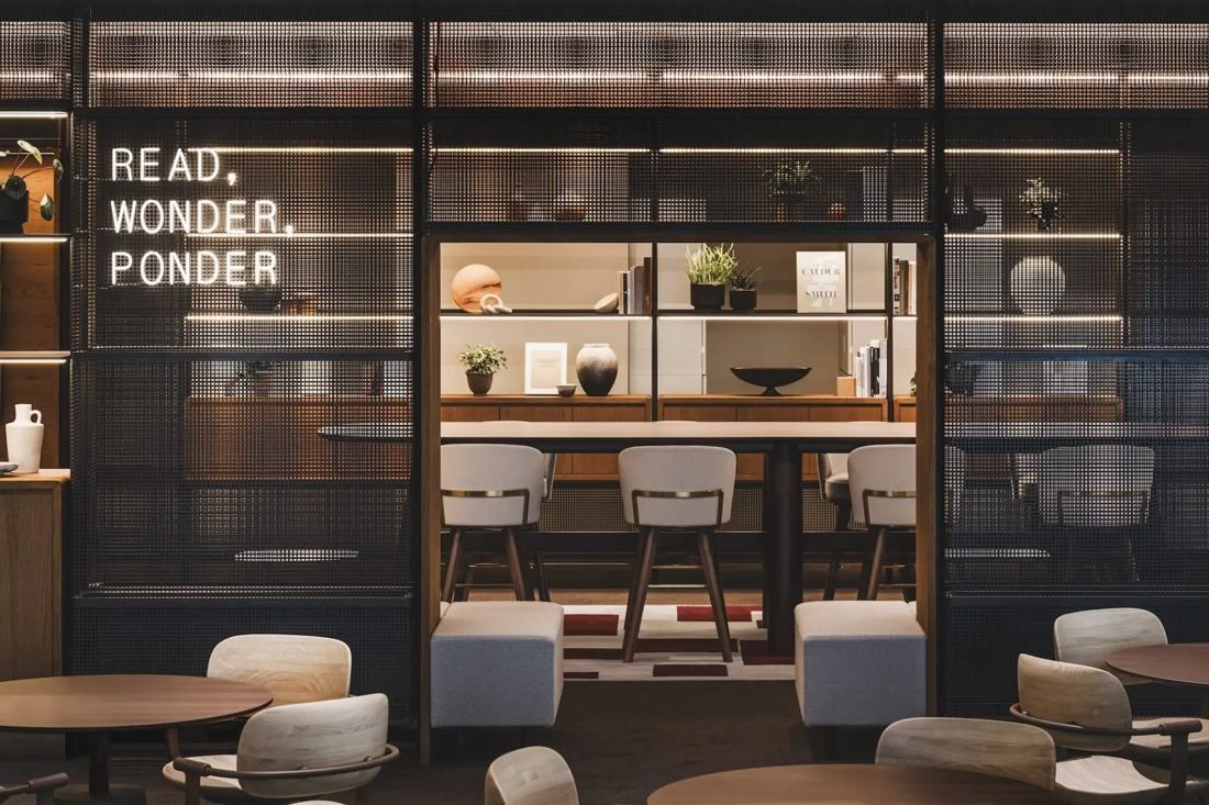ITOKI: Library shelves behind glass with the words READ, WONDER, PONDER