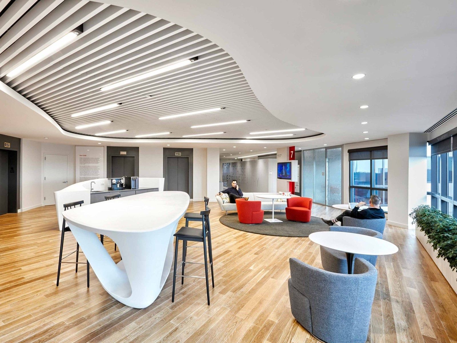 Johnson & Johnson: Lounge seating on a wood floor by the windows