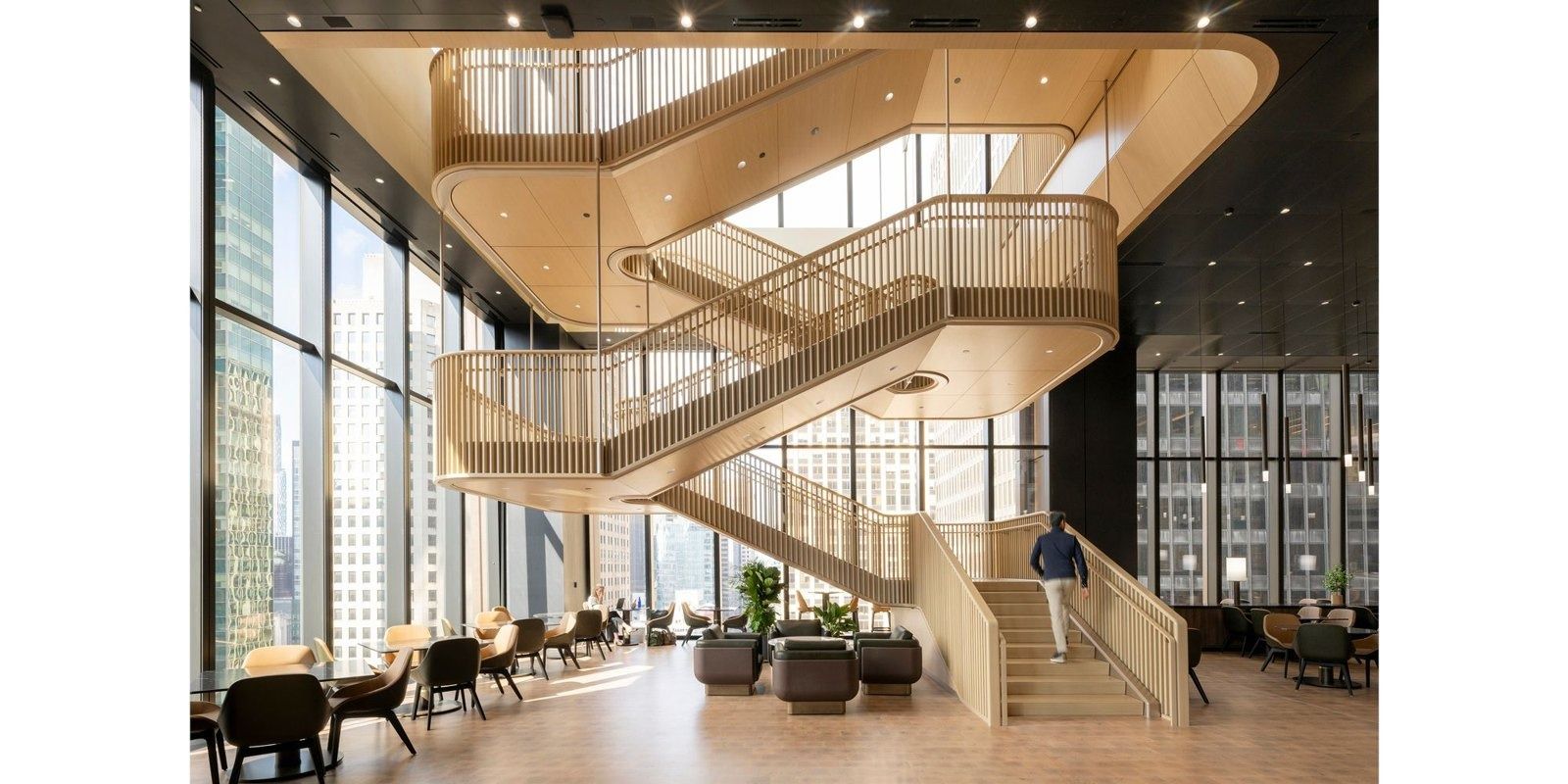 JPMorganChase: A sculptural oak staircase by tall windows