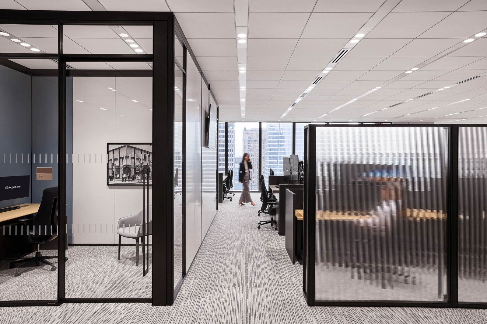 JPMorganChase: Glass-walled meeting rooms along an office floor