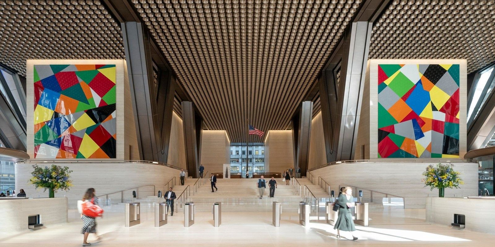 JPMorganChase: The lobby with large colorful artworks and wood ceiling slats