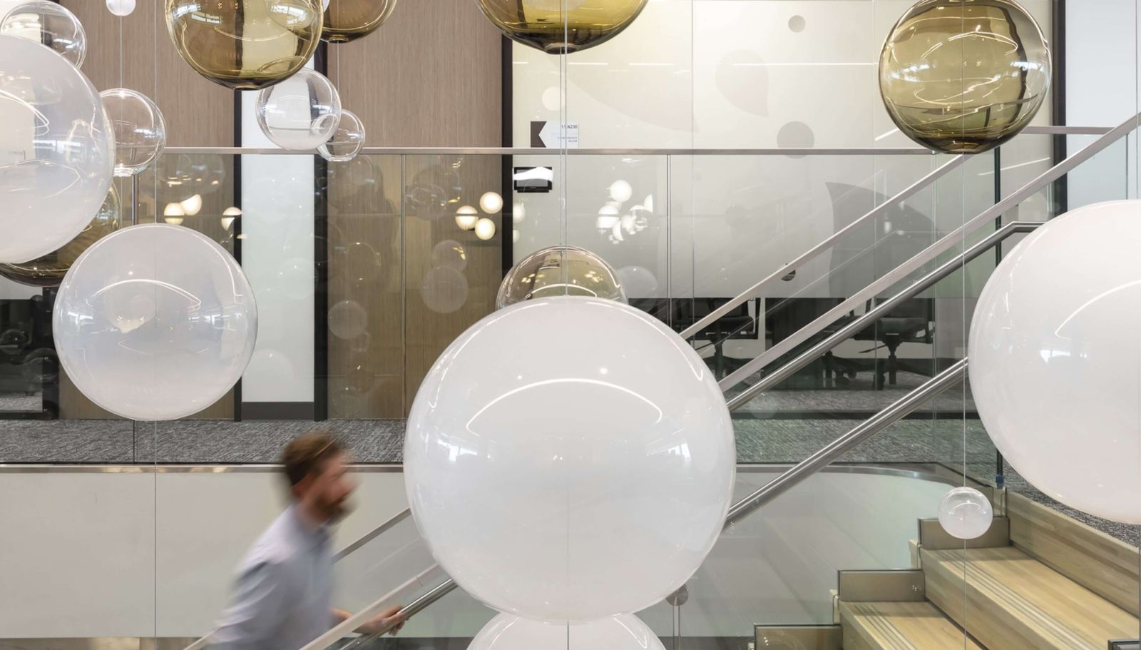 Keurig Dr Pepper: Clusters of large glass bubbles hanging over a stair, like rising soda bubbles
