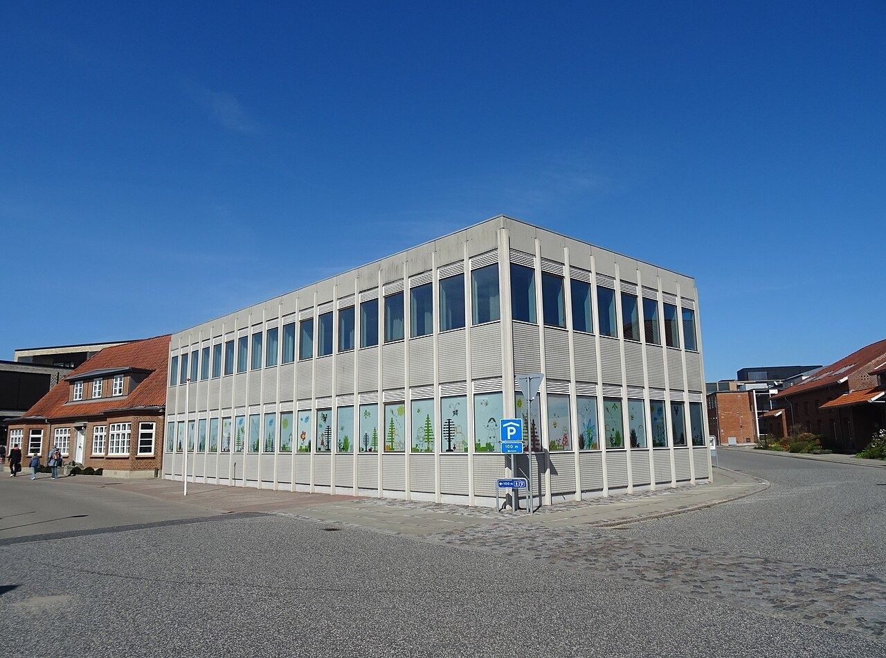 Two-storey glass building on a corner in Billund