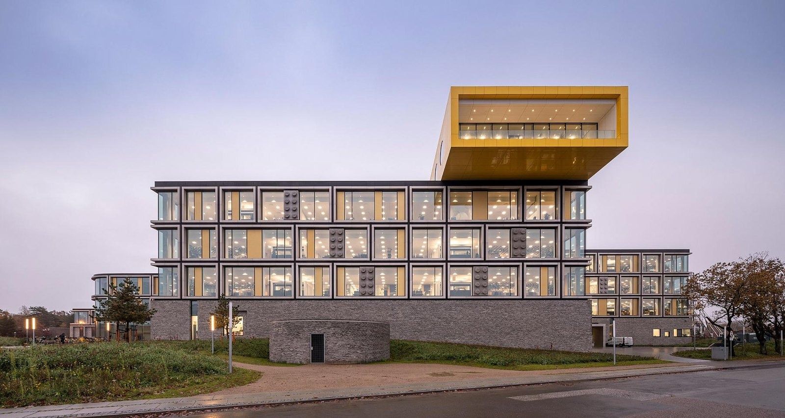 The LEGO Group: Office building with a yellow box cantilevered on top