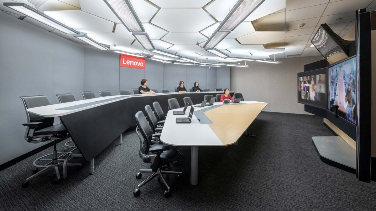 Lenovo: Conference room with a long curved table and video screens