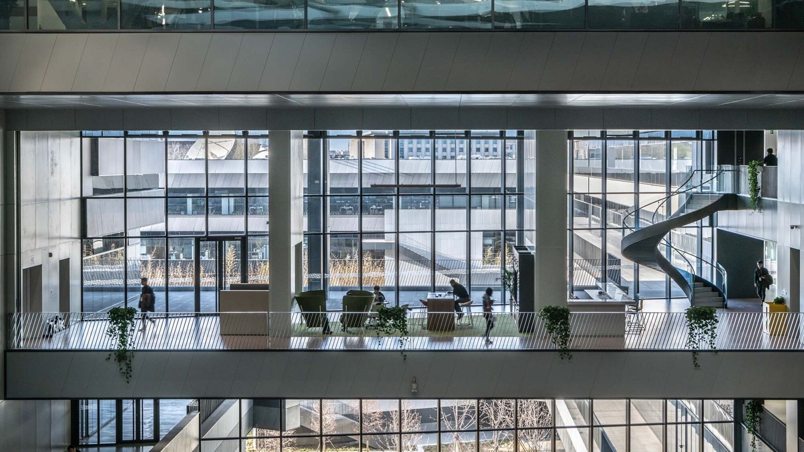 Lenovo: Multi-level office with glass walls and a spiral staircase