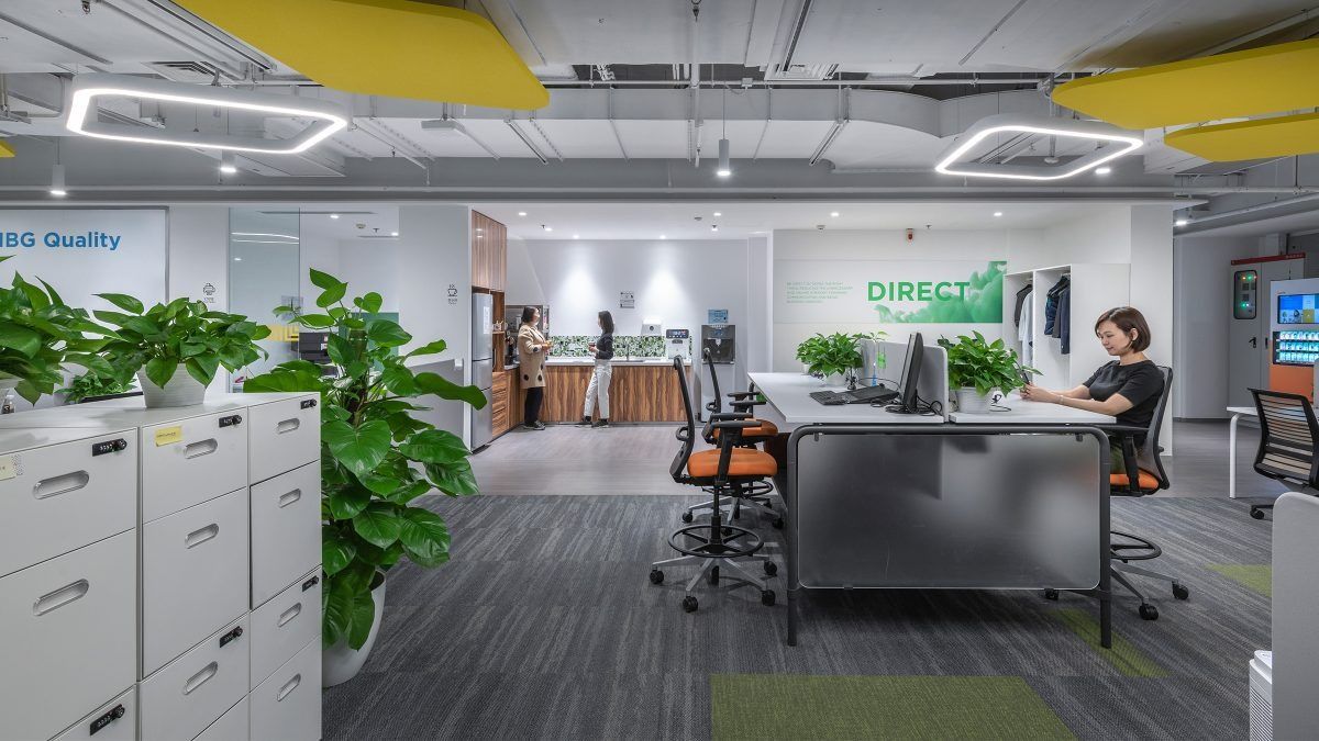 Lenovo: Open office with plants, filing cabinets and a kitchen counter