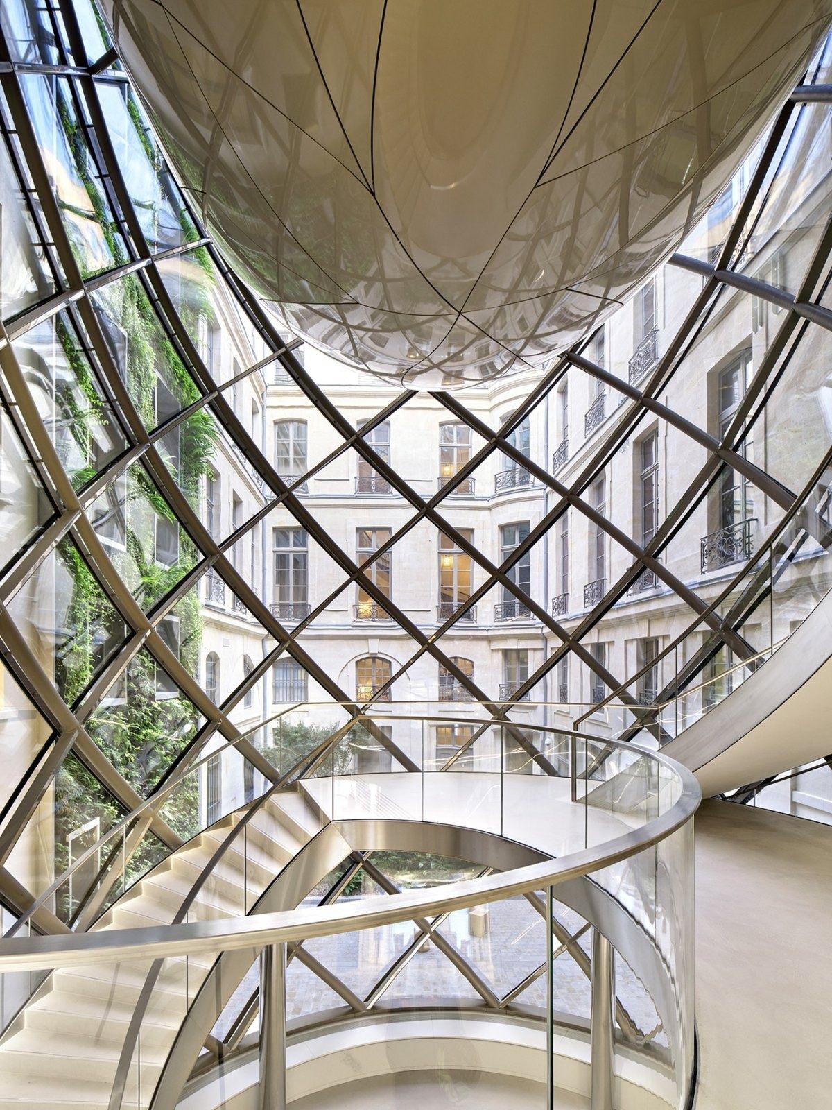 L'Oréal: A glass lattice hall seen from below