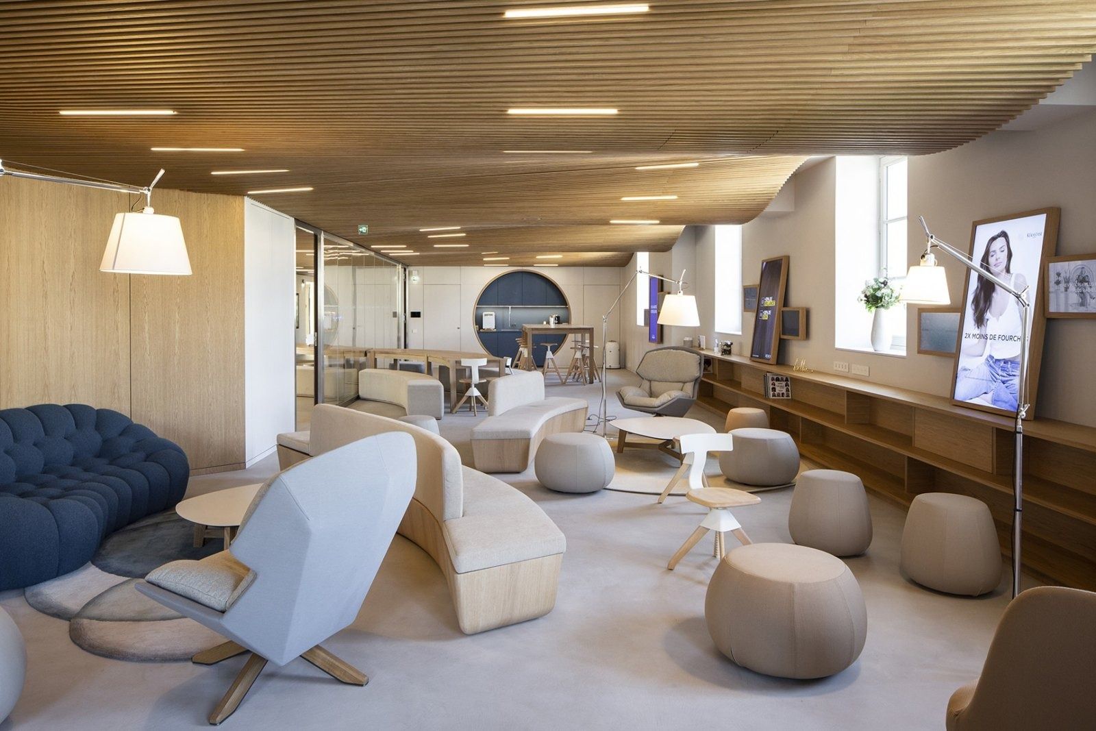 L'Oréal: A lounge with sculptural seats and a timber ceiling