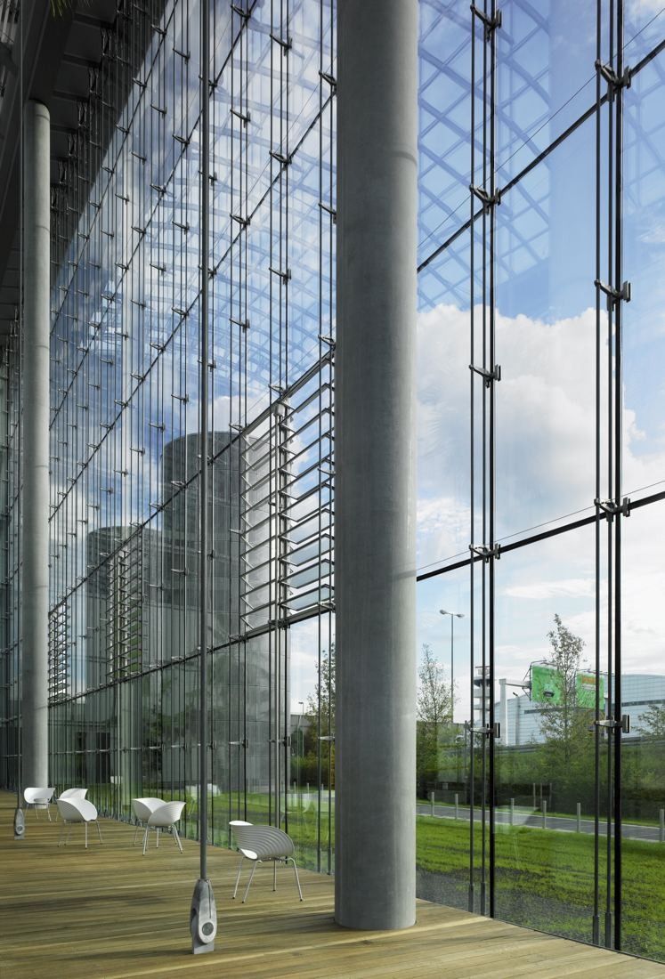 Lufthansa Group: Full-height glass wall with slim columns and a wooden floor, trees outside