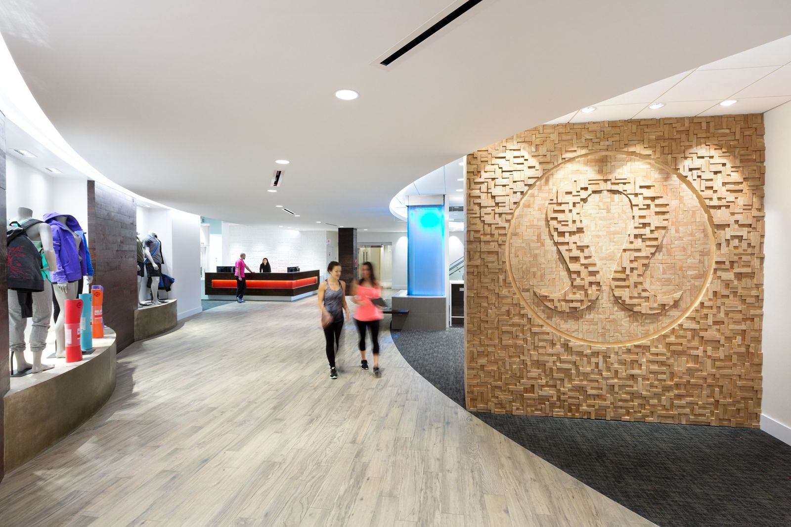 lululemon athletica: Curved corridor with a carved wooden wall panel
