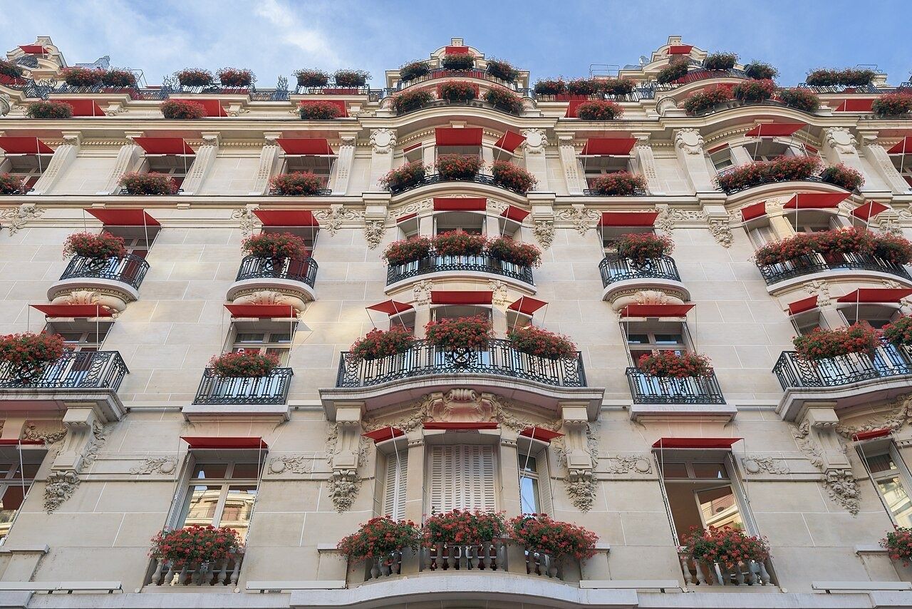 Façade of the Hôtel Plaza Athénée with red awnings