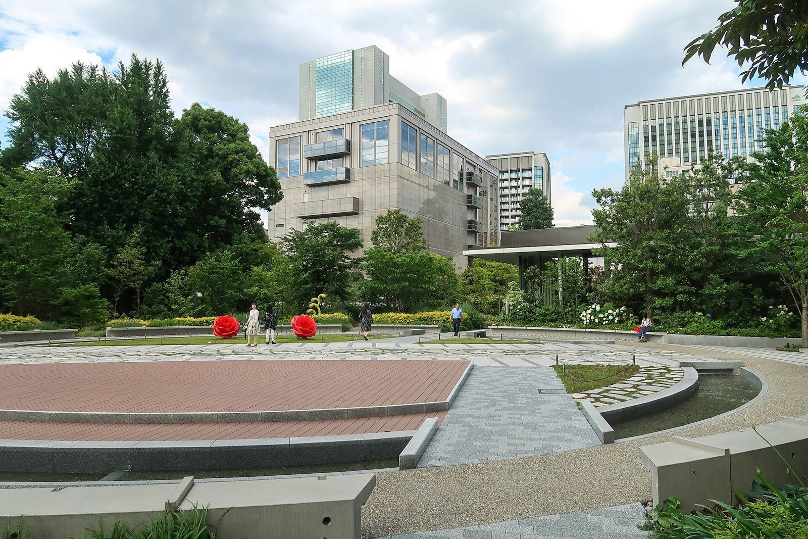 LY Corporation: Circular garden plaza with paving and planting