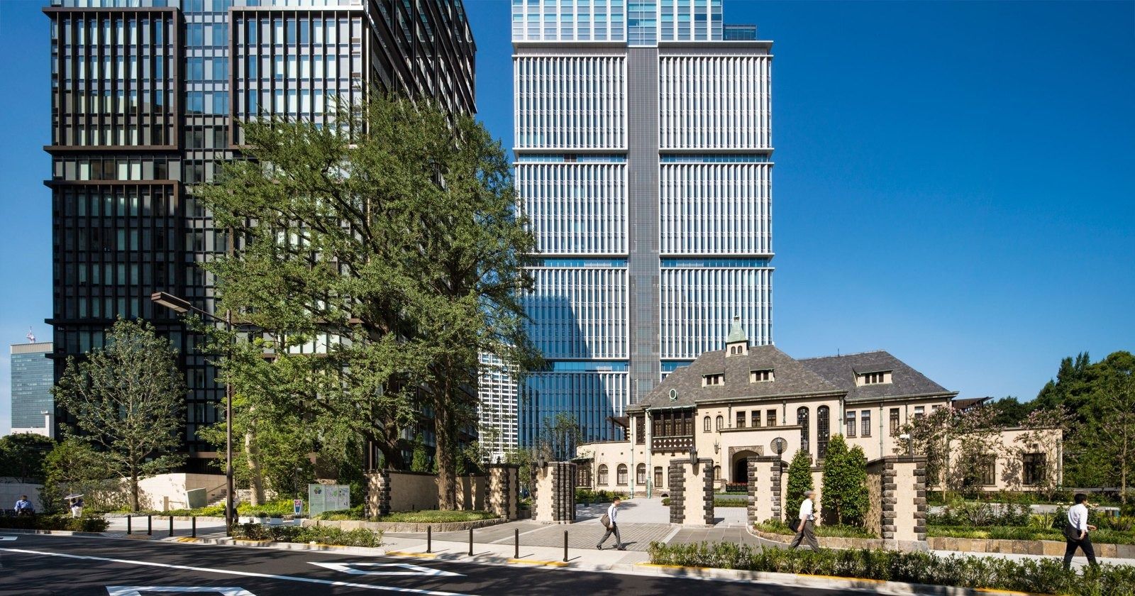 LY Corporation: Western-style historic house in front of glass towers