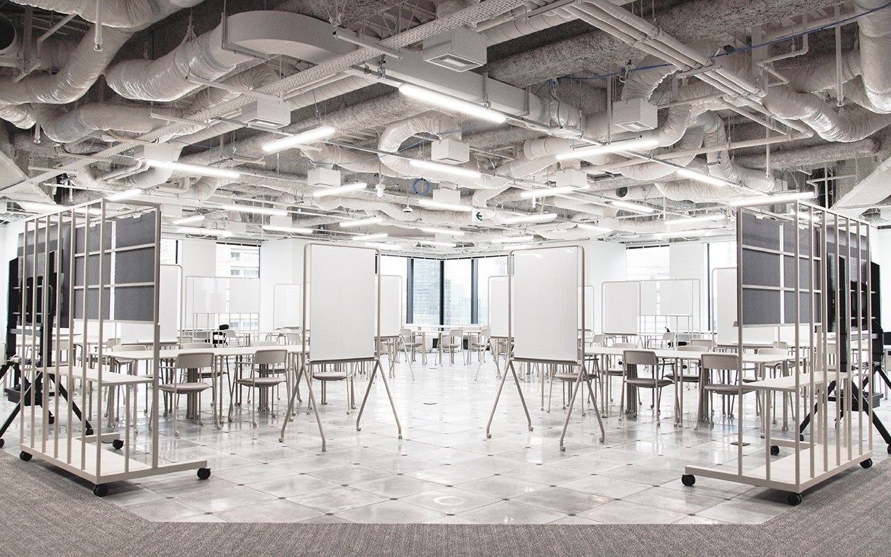 LY Corporation: White steel-frame meeting booths on a bright floor