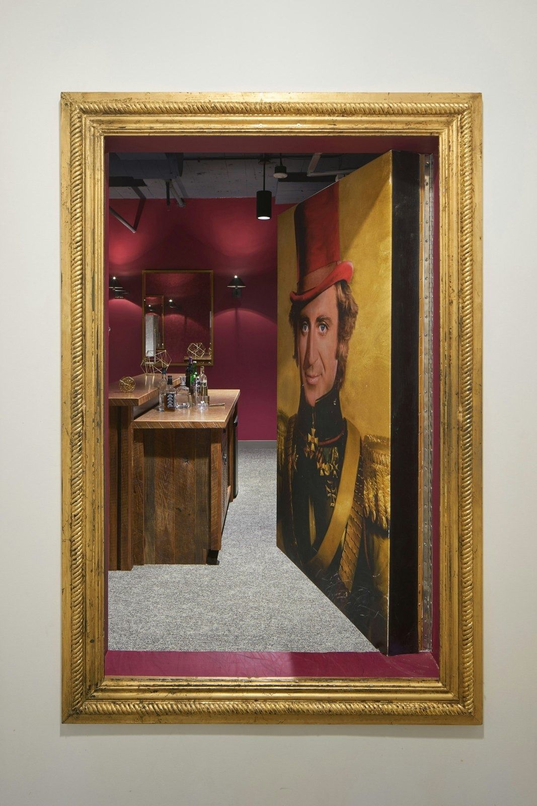 Lyft: Framed portrait that swings open onto a hidden bar