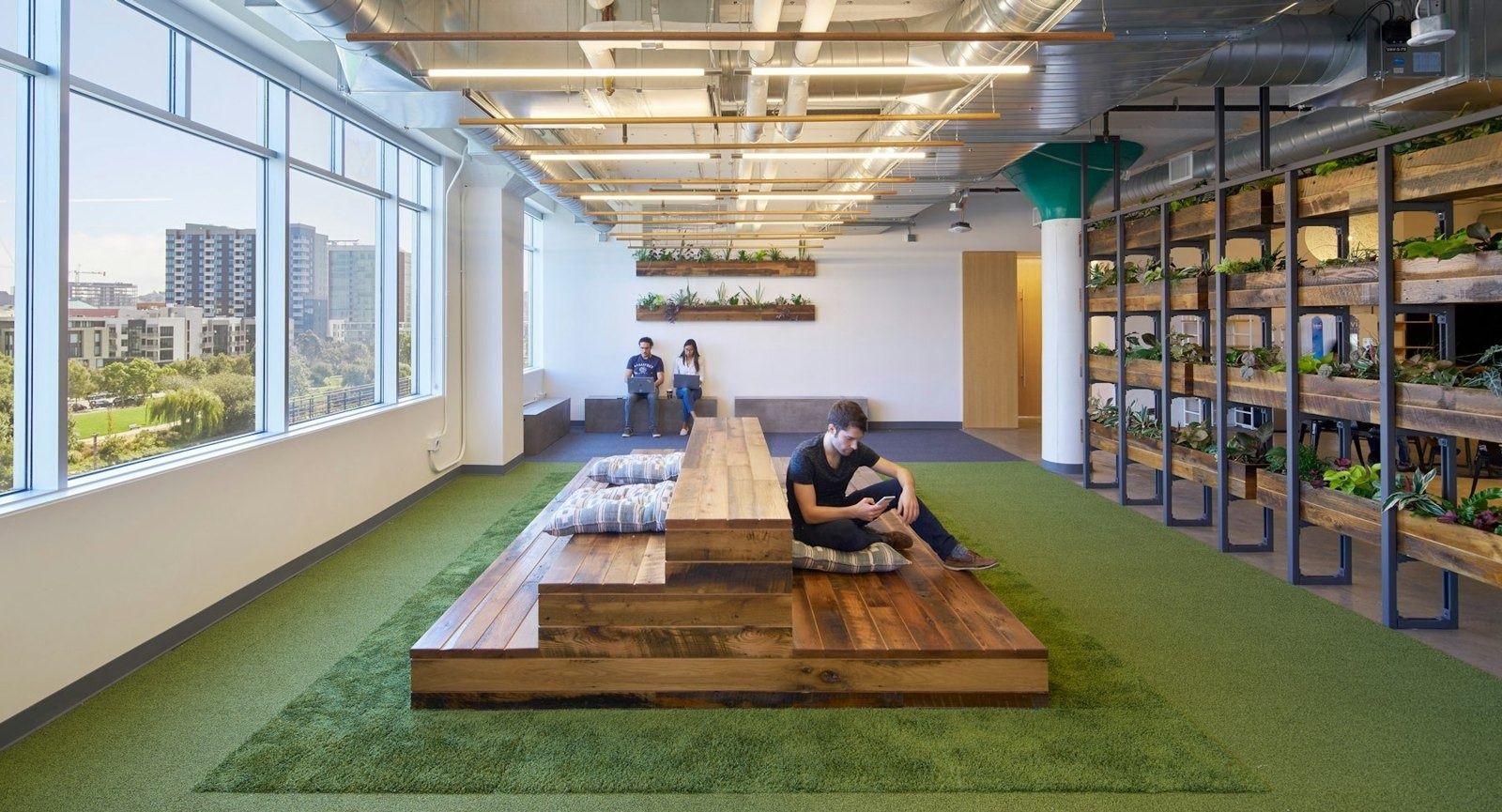 Lyft: Long indoor “parklet” with timber benches and green turf