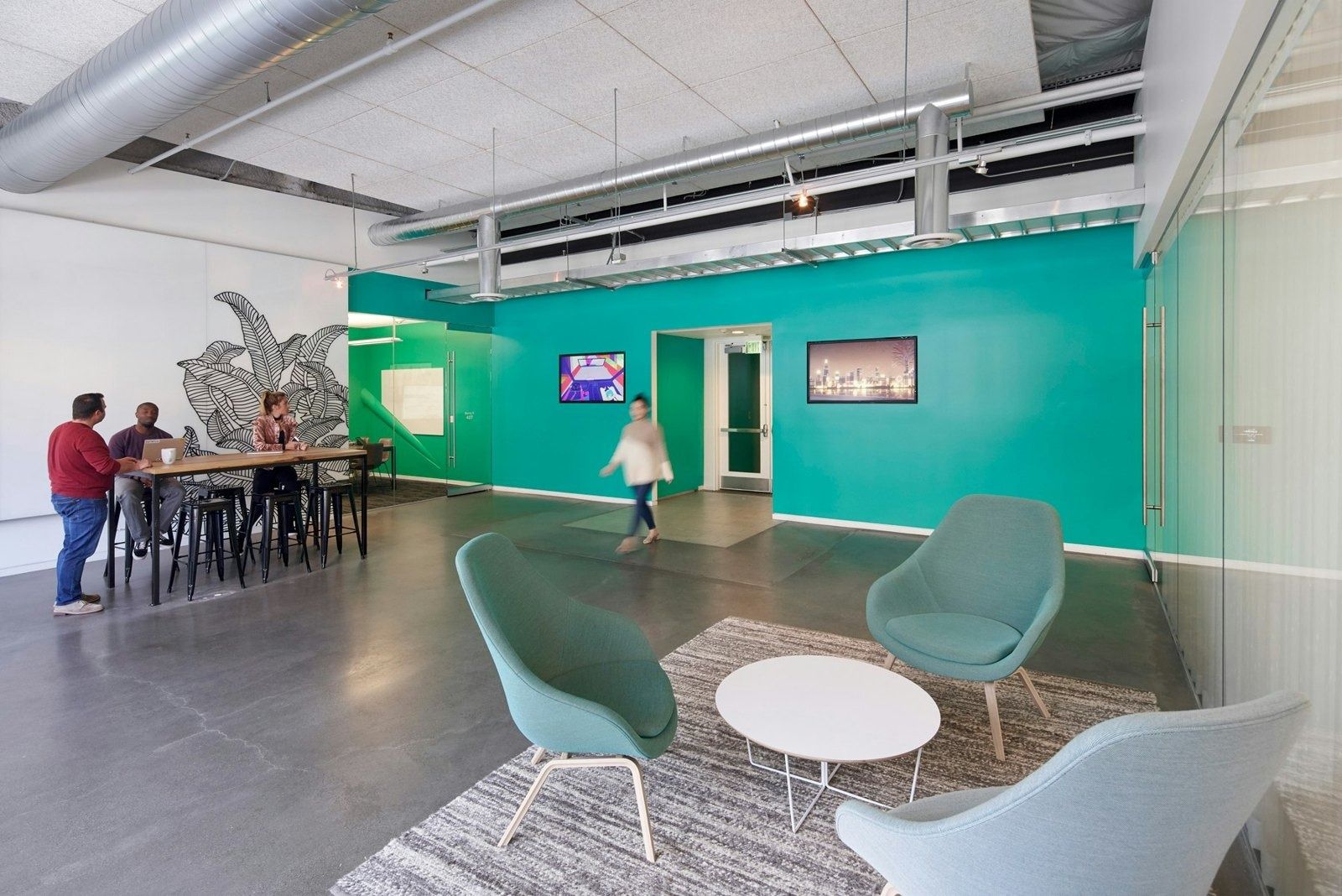 Lyft: Teal elevator lobby with lounge chairs