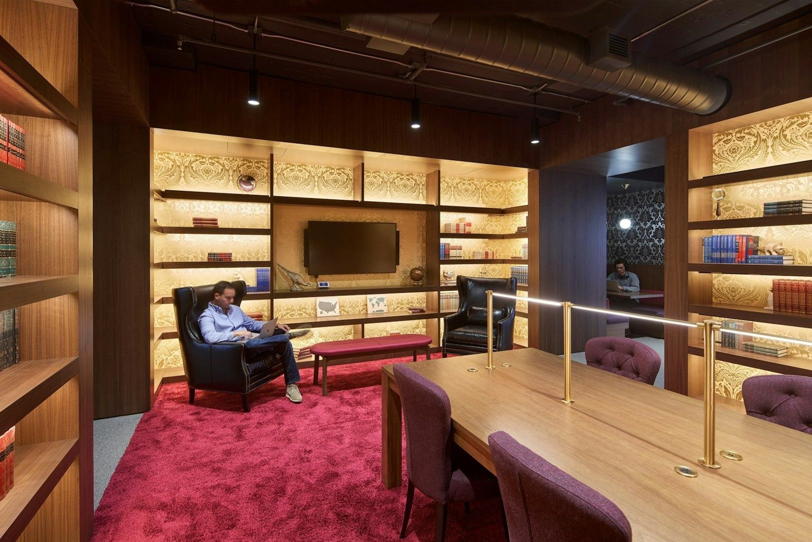 Lyft: Wood-panelled secret library with a red carpet