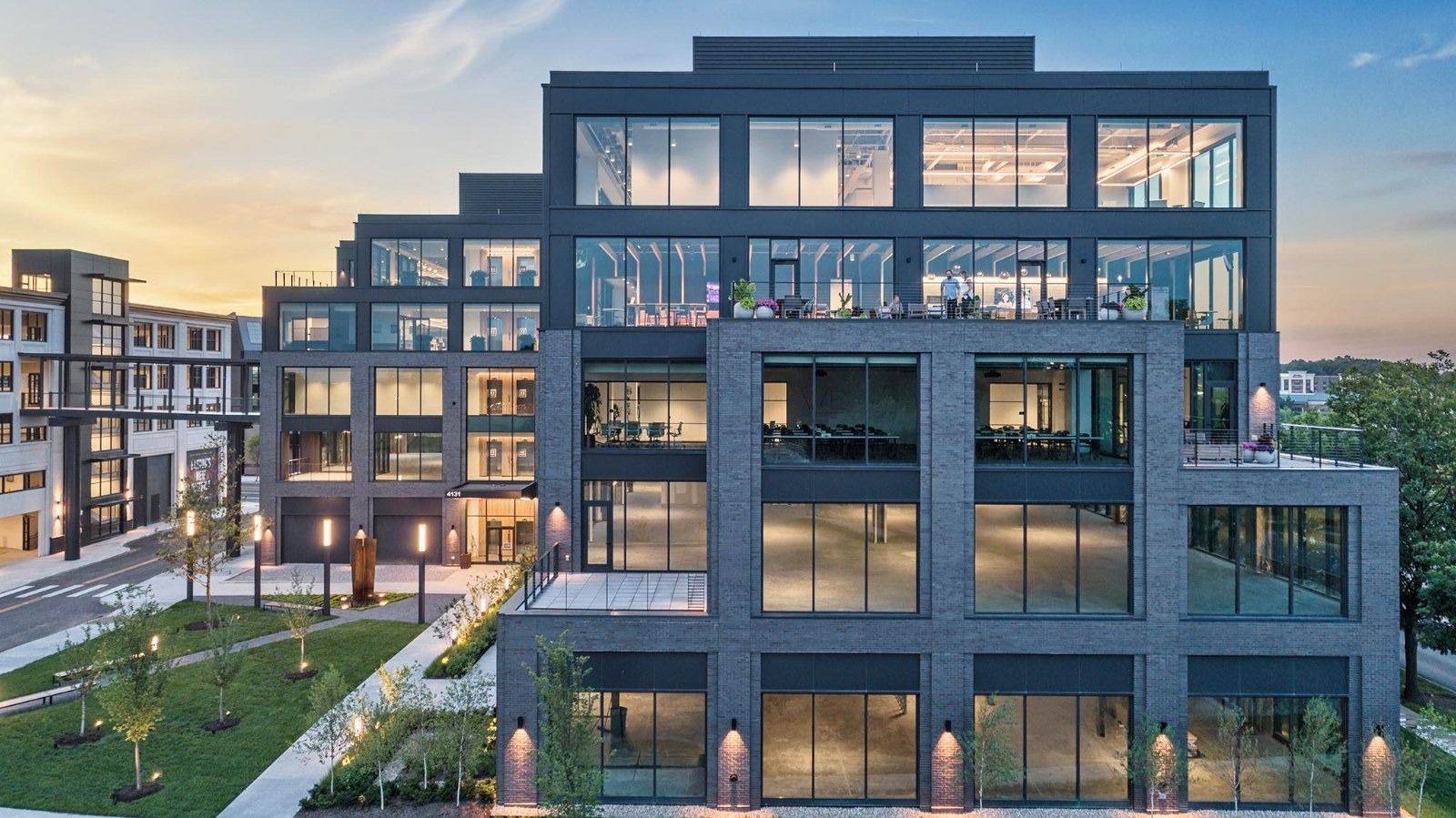 M/I Homes: Terraces on an office building at dusk