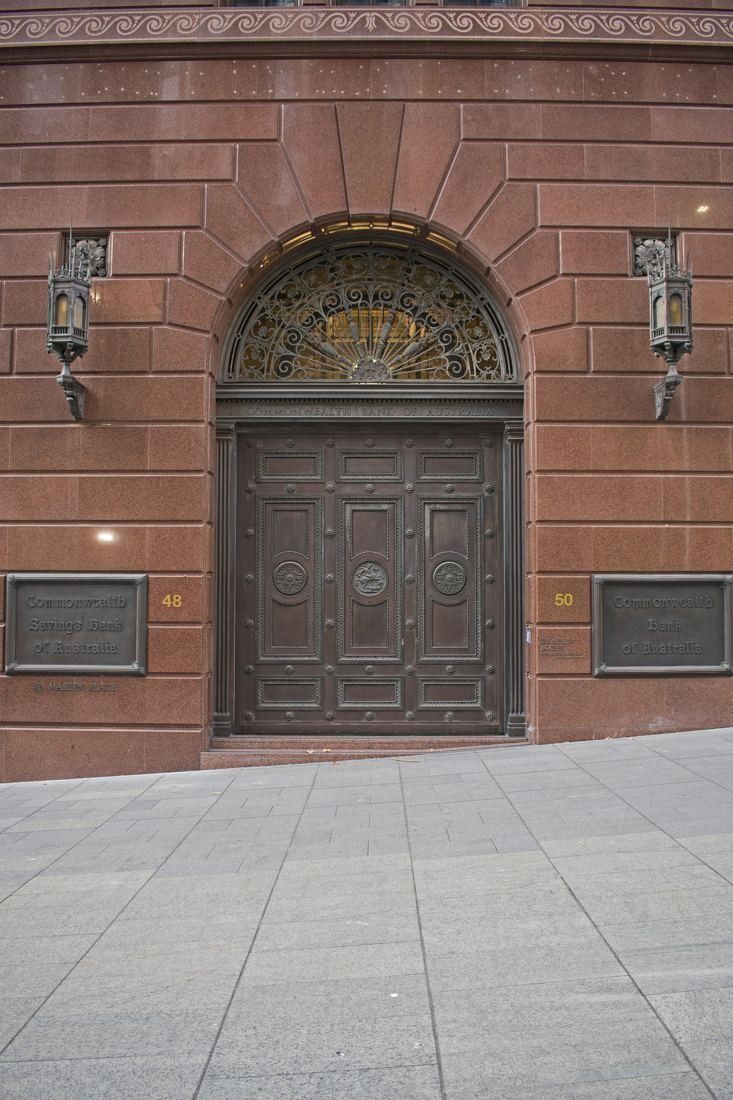 Macquarie Group: Arched timber doorway in a granite facade