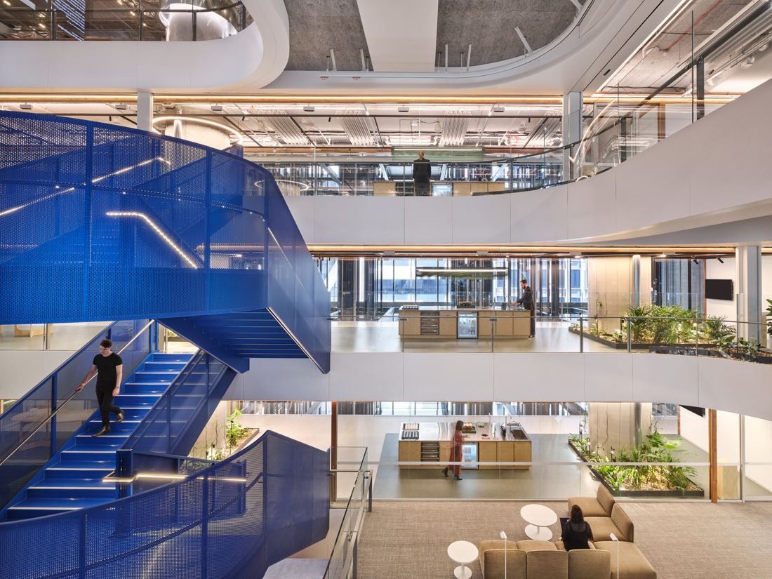 Macquarie Group: Blue perforated staircase spiralling between open floors