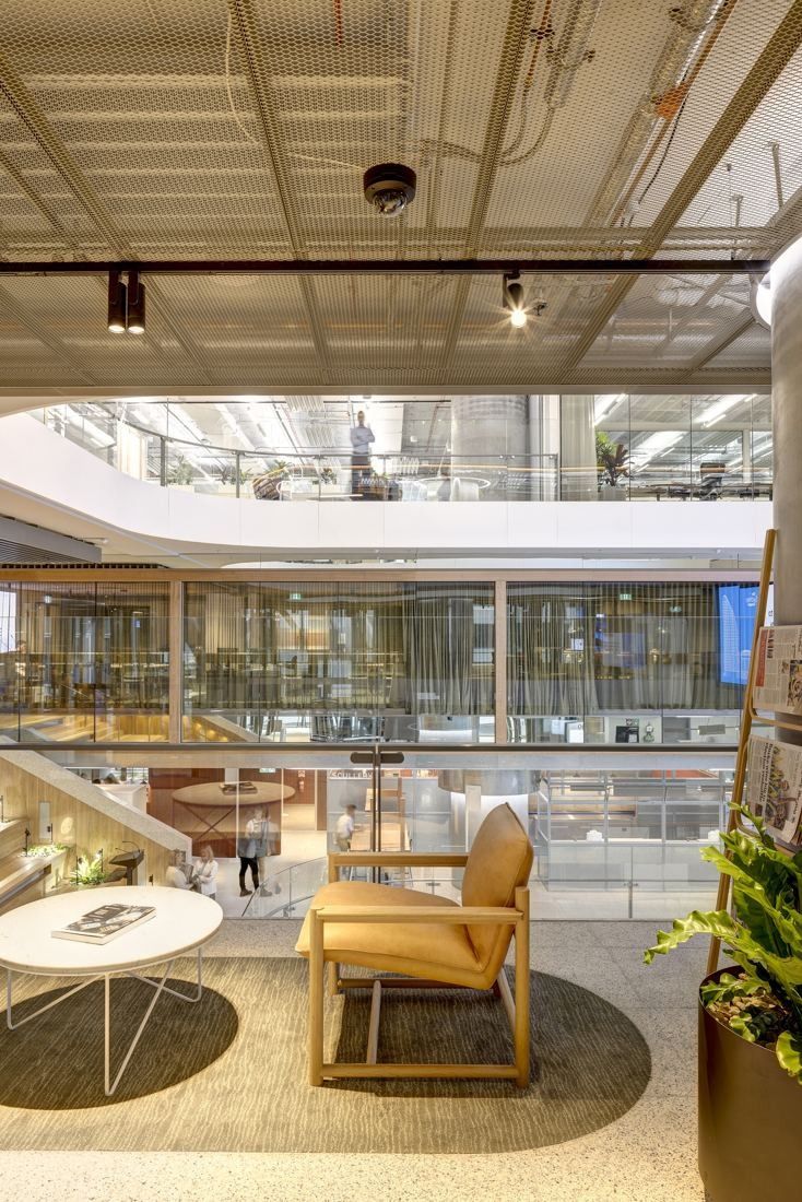 Macquarie Group: Lounge chairs on a floor overlooking the atrium