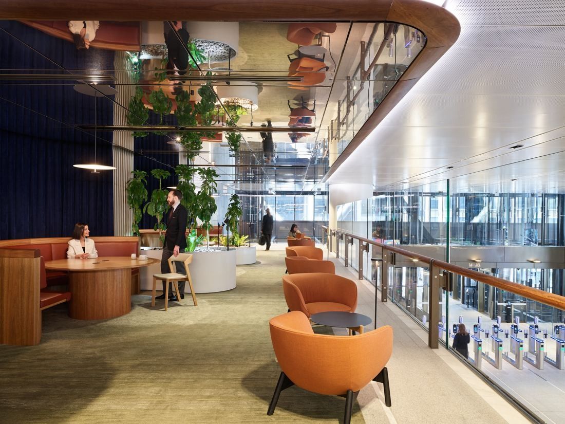 Macquarie Group: Orange armchairs and plants along a curved balcony