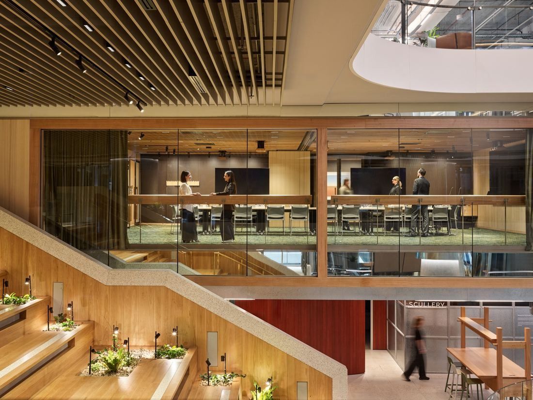 Macquarie Group: Timber stepped seating facing a glazed meeting space