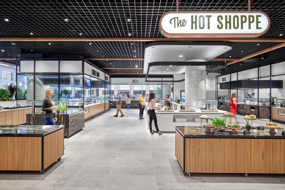 Marriott International: Food hall with wooden counters and a hanging sign reading The Hot Shoppe