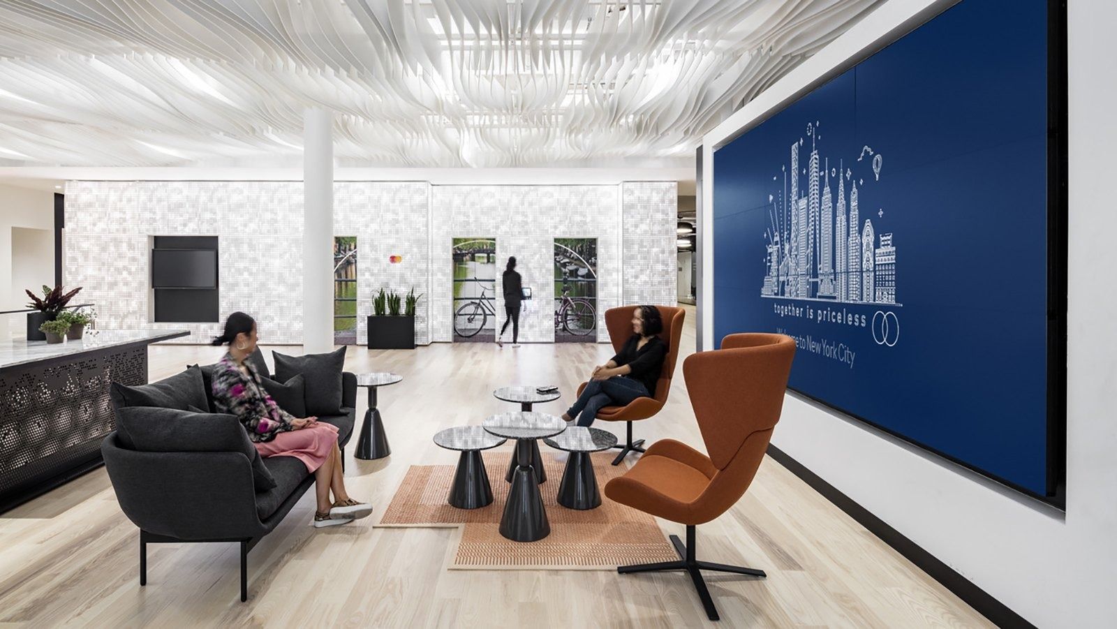 Mastercard: A lounge with a big blue city graphic