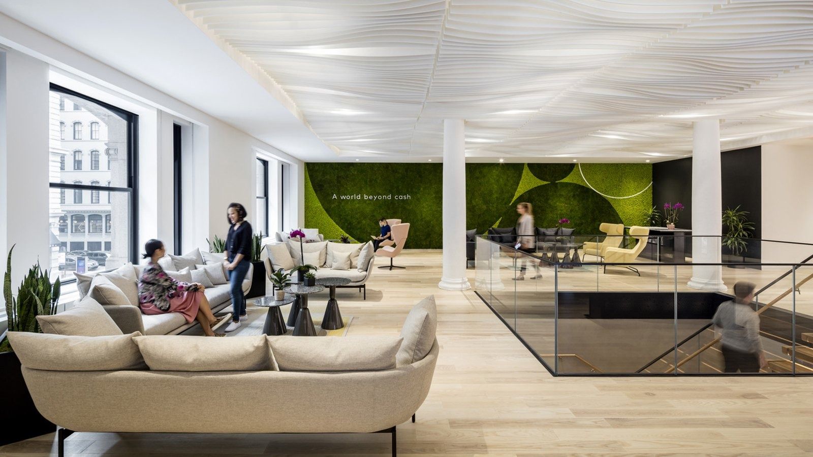 Mastercard: A lounge with sofas and a moss wall