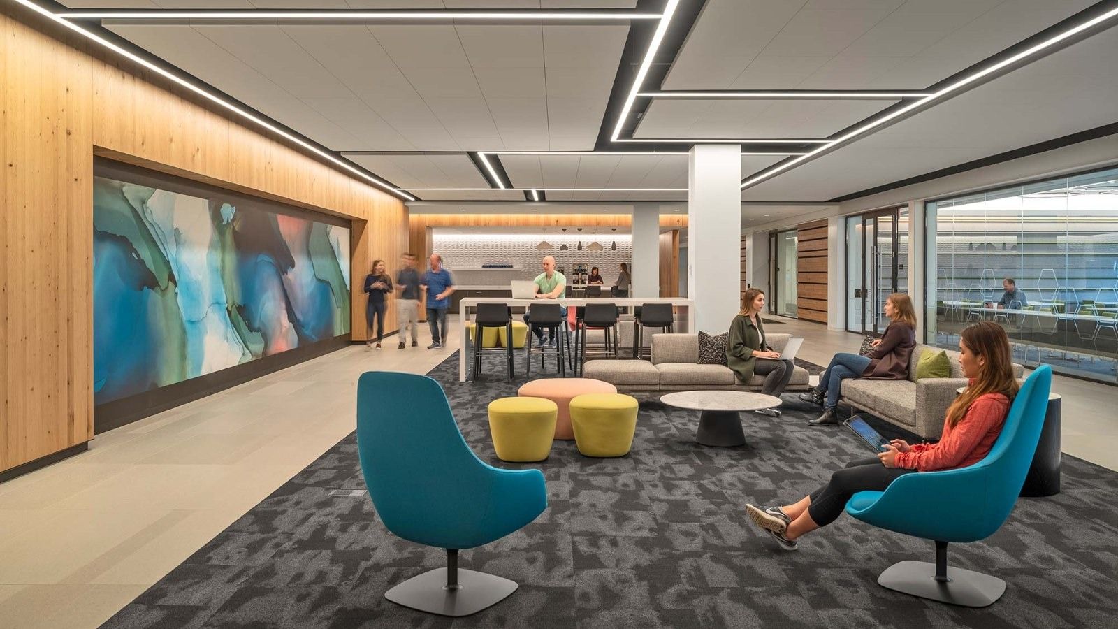 MathWorks: A lounge with a long mural and armchairs