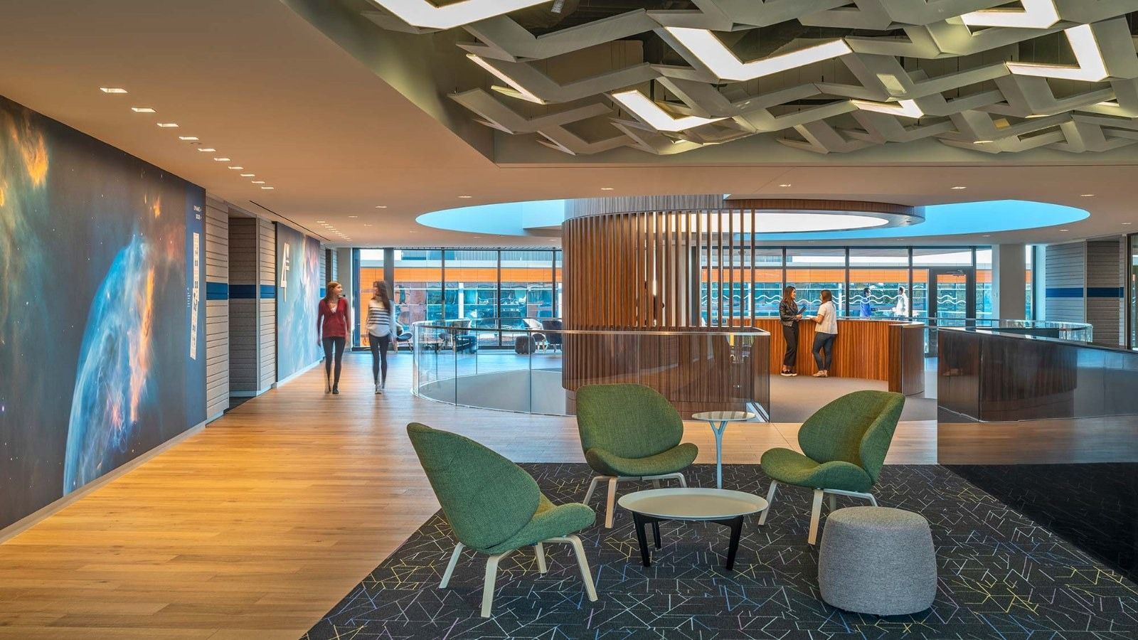 MathWorks: A lounge with green chairs under a patterned ceiling