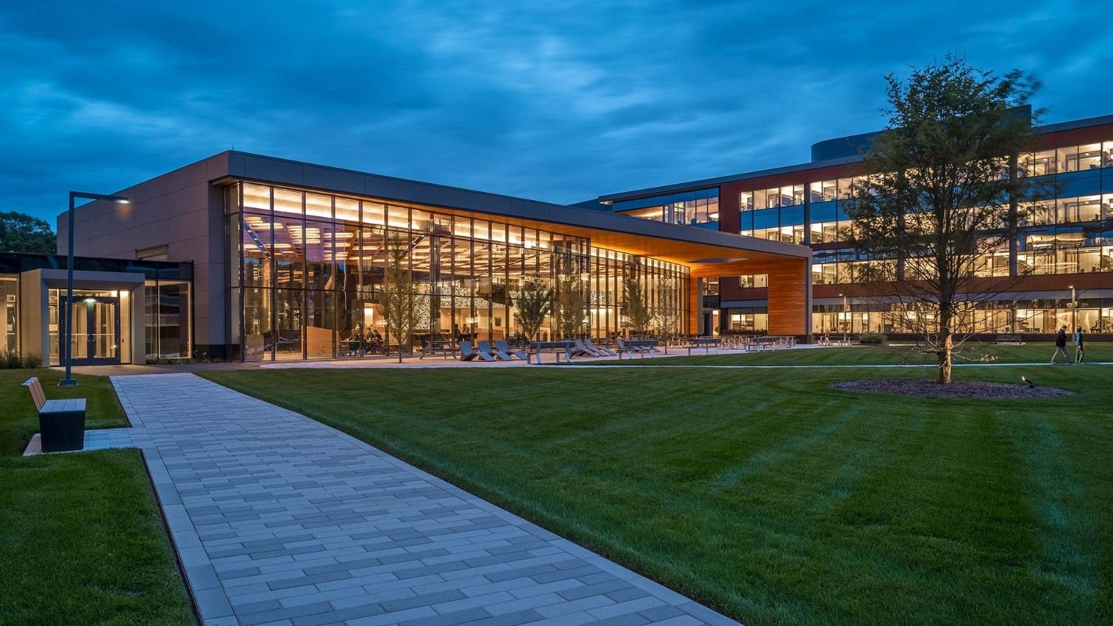 MathWorks: The campus at dusk across a lawn