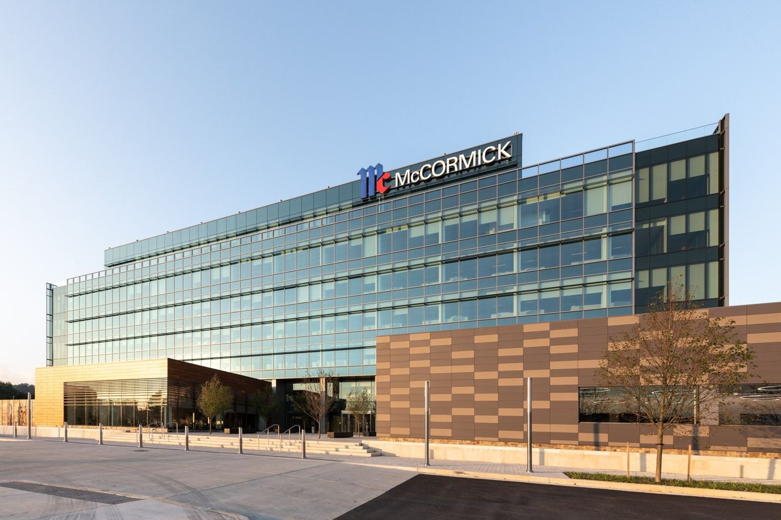 McCormick: Glass building with the McCormick logo above a paneled wing