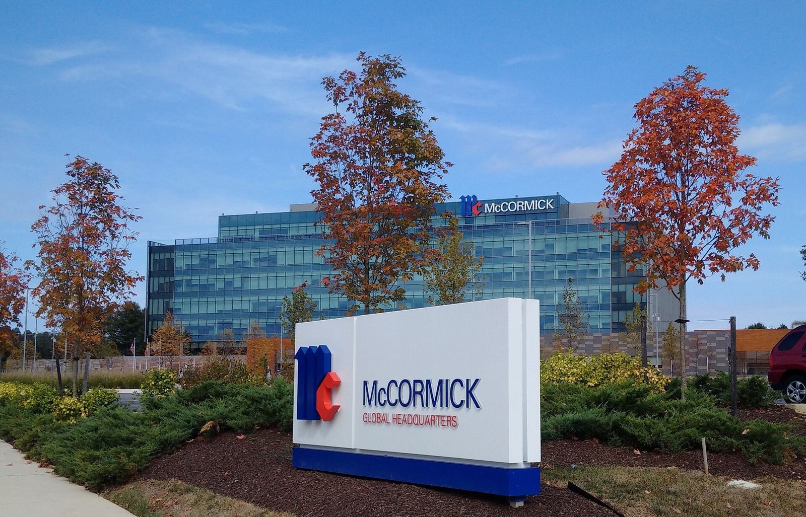 McCormick: McCormick Global Headquarters sign with autumn trees