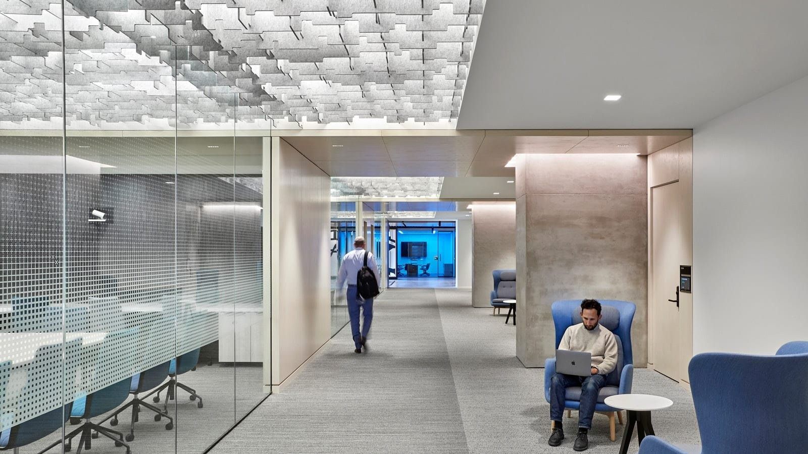 McDonald's: Glass-walled meeting rooms beside a lounge