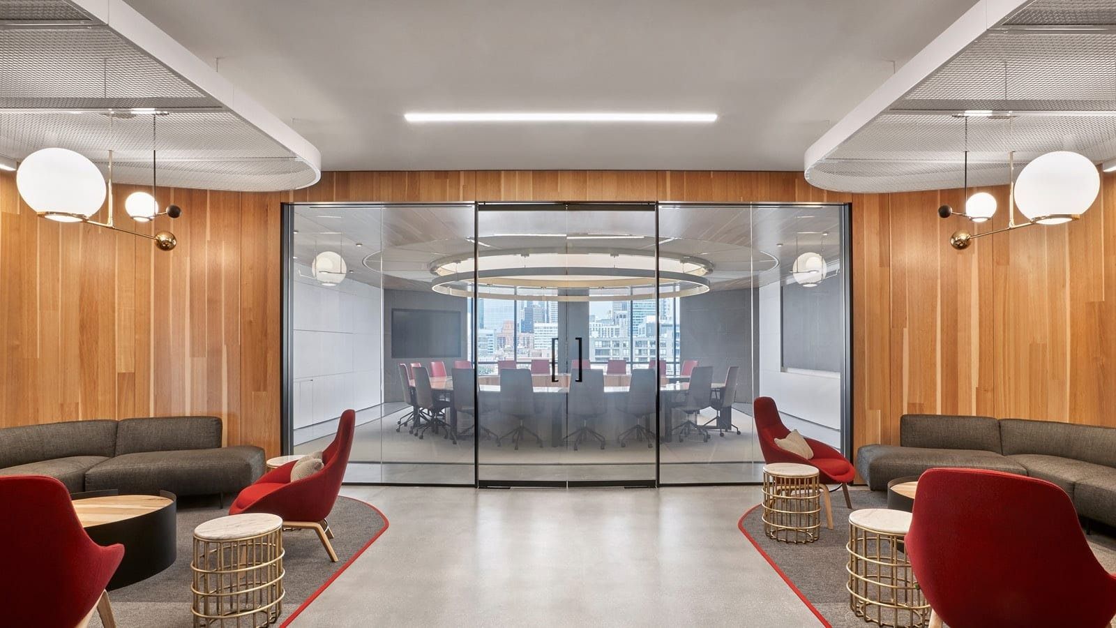 McDonald's: Lounge with red chairs and globe lights by a meeting room