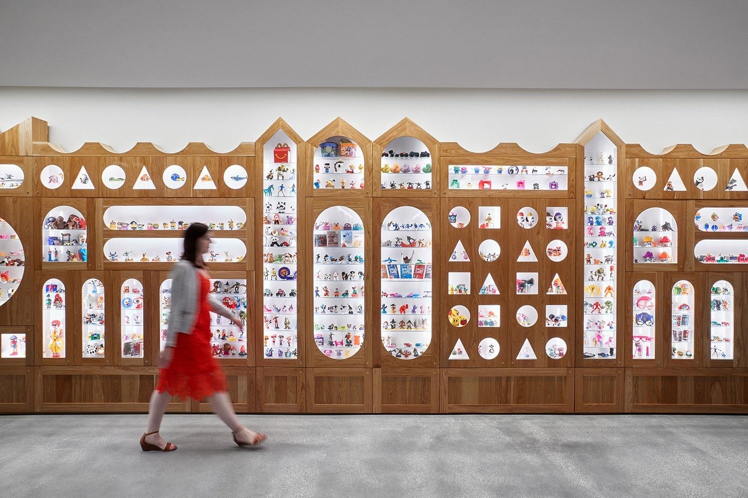 McDonald's: Wall of Happy Meal toys in a scalloped frame